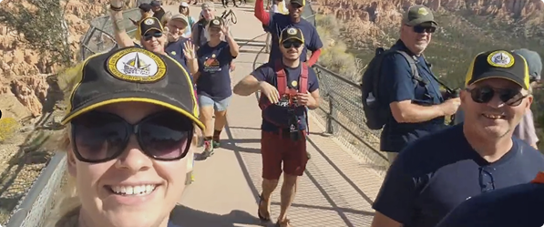Veterans hiking on a trail wearing Waypoint Vets caps